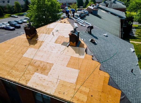 How Roofing Replacement Contractors Ensure Proper Drainage